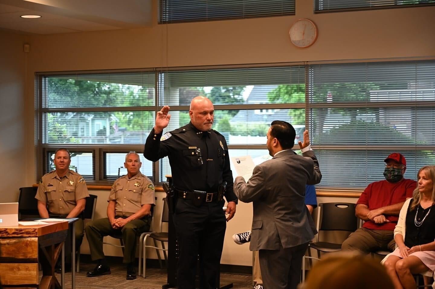 Rob Carlson is sworn in as Yelm’s new chief of police by Mayor Joe DePinto at a meeting on Tuesday, June 28.
